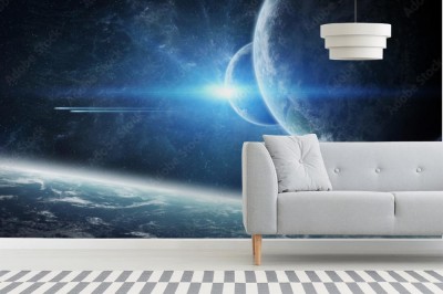 Fototapeta Wschód słońca nad planetą Ziemią w kosmosie