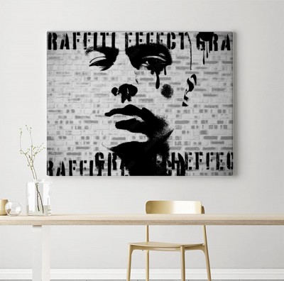 Obraz na płótnie Grafika twarzy na ścianie z cegieł