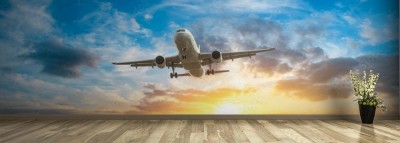 Fototapeta Samolot na niebie przed wschodem słońca