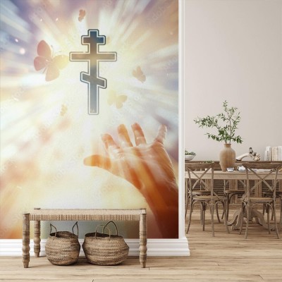 Fototapeta Ręce na tle symbolu chrześcijaństwa - krzyż prawosławny