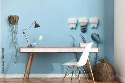 Fototapeta Zdrowe białe zęby i implanty na niebieskim tle