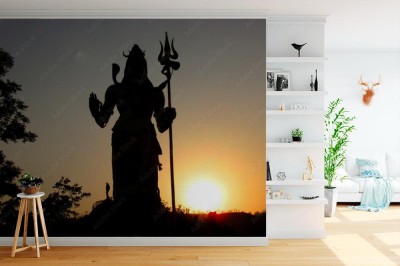 Fototapeta Sylwetka hinduskiego boga Shiva o zachodzie słońca