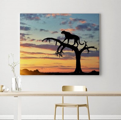 Obraz na płótnie Sylwetka geparda w drzewie