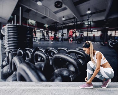 Fototapeta Siłownia z ciężarkami i wyposażeniem