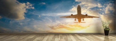 Fototapeta Samolot na niebie przy wschodem słońca