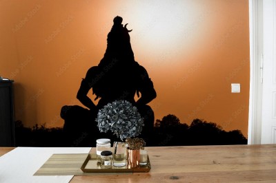 Fototapeta Sylwetka posągu hinduskiego boga Śiwy nad brzegiem Gangesu w Rishikesh w północnych Indiach