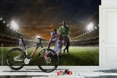 Fototapeta Gracze piłki nożnej w akci na zmierzchu stadium tła panoramie