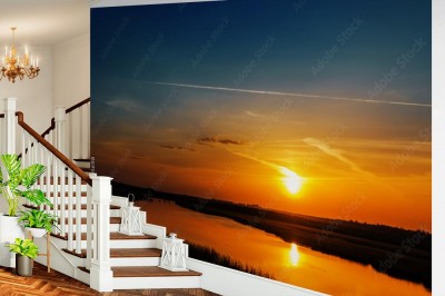 Fototapeta Ciemny pomarańczowy zachód słońca nad rzeką