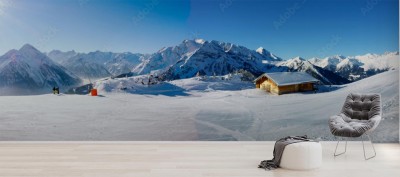 Fototapeta Zimowa panorama z narciarzami i chatą narciarską