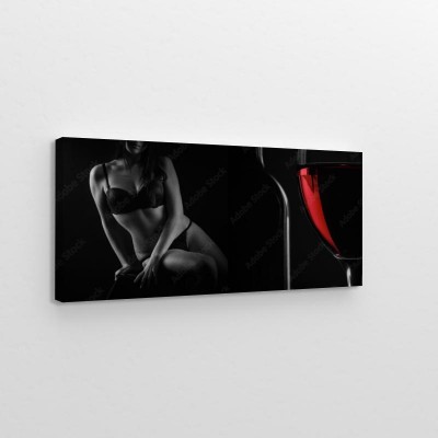 Obraz na płótnie Piękna sylwetka kobiecego ciała i kieliszek czerwonego wina