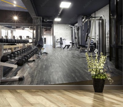 Fototapeta Nowoczesne wnętrze siłowni z różnorodnym wyposażeniem