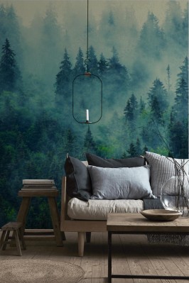 Fototapeta Las osnuty gęstą mgłą w górskim krajobrazie