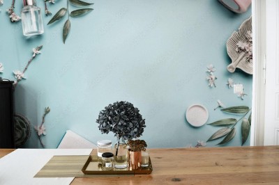 Fototapeta Kosmetyki do twarzy, liście i kwiat wiśni na niebieskim stole