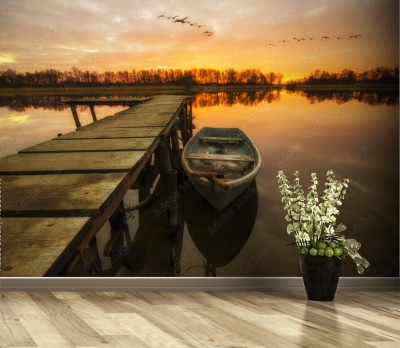Fototapeta Łódka zacumowana przy drewnianym pomoście w piękny poranek