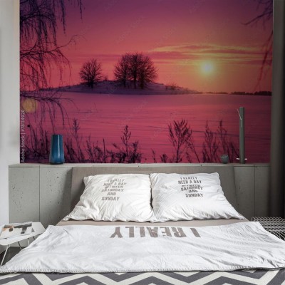 Fototapeta Zachód słońca nad ośnieżonym polem