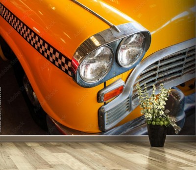 Fototapeta Żółta taksówka, kolorowe detale na reflektorze Taxi