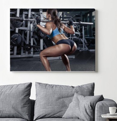 Obraz na płótnie Piękna seksowna młoda kobieta w siłowni
