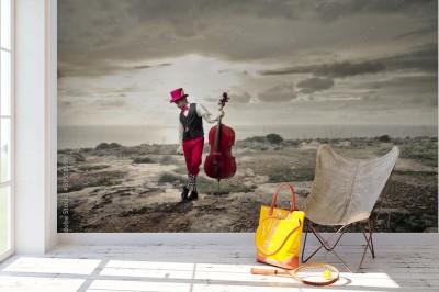 Fototapeta Wiolonczelista z czerwonym motywem na czarno-białym tle