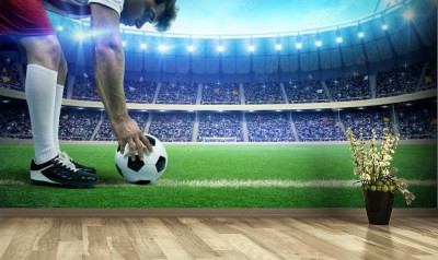 Fototapeta Piłkarz z piłką na stadionie