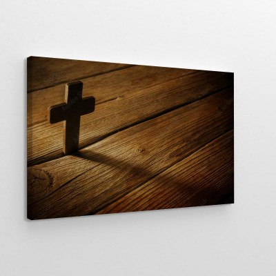 Obraz na płótnie Drewniany krzyż na tle drewna