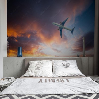 Fototapeta Samolot na niebieskim niebie i  w chmurach