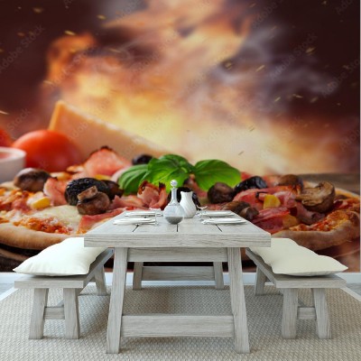 Fototapeta Pyszna włoska pizza serwowana na drewnianym stole