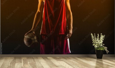 Fototapeta Portret koszykarza trzymającego piłkę