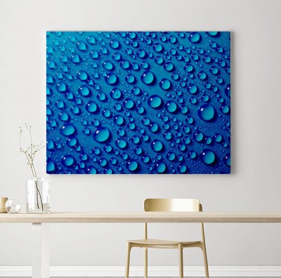 Obraz na płótnie Wodne krople na błękitnym tle