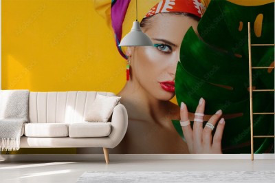 Fototapeta Kobieta za liściem