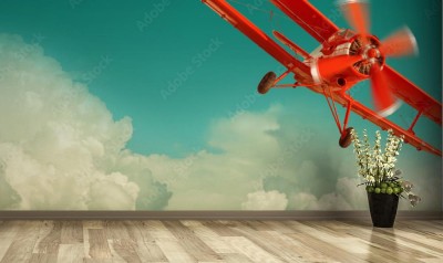 Fototapeta Czerwony retro samolot na letnim niebie