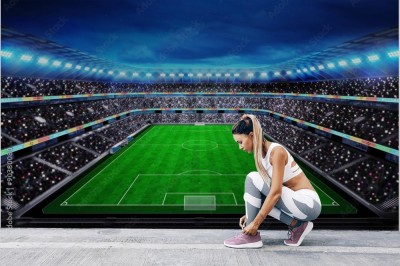 Fototapeta Widok z góry na stadion piłkarski z kibicami na trybunach