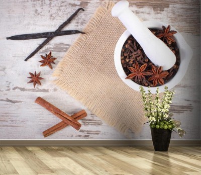 Fototapeta Pachnące goździki i anyż w moździerzu i przyprawach na rustykalnej desce