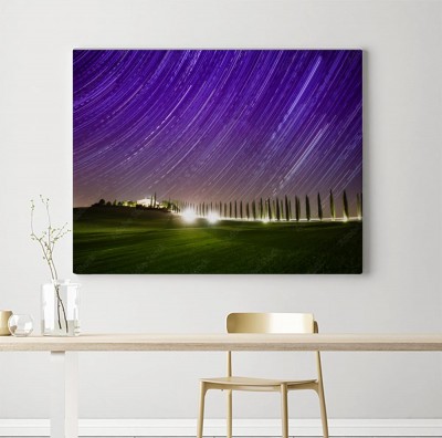 Obrazy do salonu Piękny krajobraz Toskanii z gwiazdami na niebie