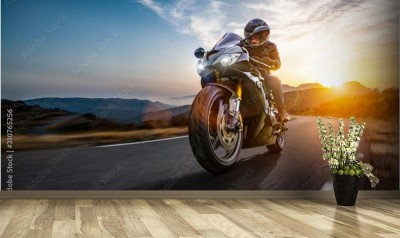 Fototapeta Podróż motocyklem  przy zachodzącym słońcu