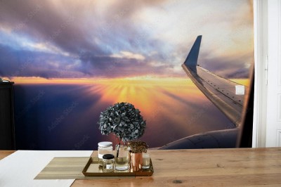 Fototapeta Skrzydła samolotu o zachodzie słońca