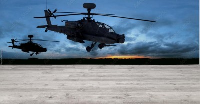 Fototapeta Helikopter bojowy na tle zachodzącego słońca