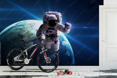 Fototapeta Astronauta w kosmosie na tle planety