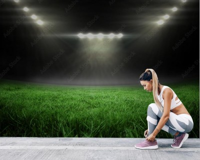 Fototapeta Boisko do piłki nożnej z jasnymi światłami