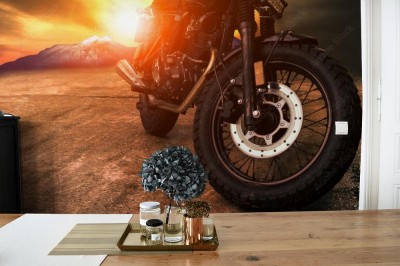Fototapeta Stary motocykl retro i piękny zachód słońca na tle nieba