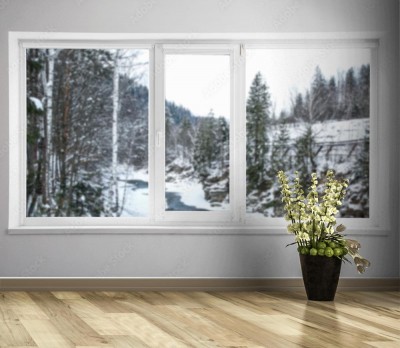 Fototapeta okno z widokiem na zimowy krajobraz