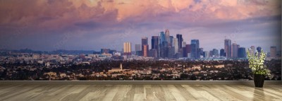Fototapeta Panoramiczny widok na panoramę centrum Los Angeles o zachodzie słońca, kolorowe chmury burzowe pokrywające niebo; Kalifornia