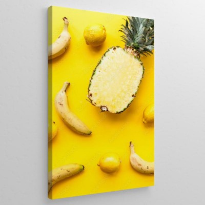 Obraz na płótnie Naturalny ananas, banany i cytryny na żółtym tle