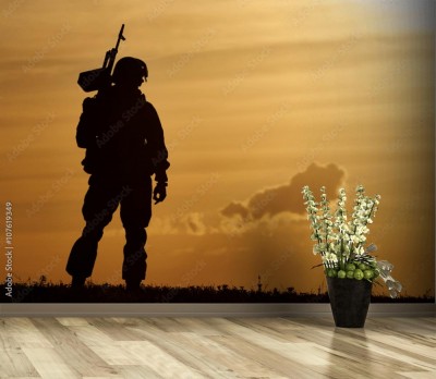 Fototapeta Militarny motyw z żołnierzem uzbrojonym w karabin maszynowy