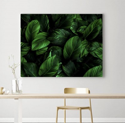 Obrazy do salonu do salonu z zielonymi liśćmi w tle