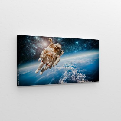 Obrazy do salonu Lewitujący kosmonauta