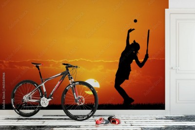 Fototapeta Sylwetka kobiety grającej w tenisa o zachodzie słońca