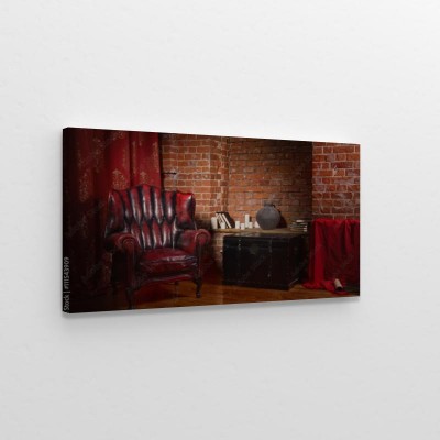 Obraz na płótnie Antyczne krzesło przy ścianie z cegieł