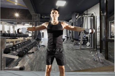 Fototapeta Nowoczesne wnętrze siłowni z różnorodnym wyposażeniem