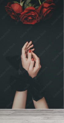 Fototapeta Kobiece ręce związane wstążką i róża kwiaty na czarnym tle